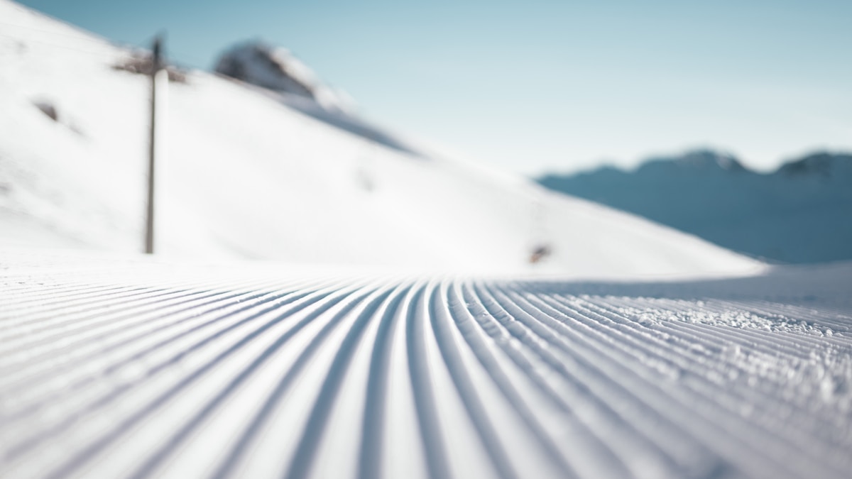Snow covered field during day - Photo by Valentin Kremer